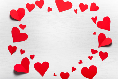 Wooden white background with red hearts. The concept of Valentine Day.の写真素材
