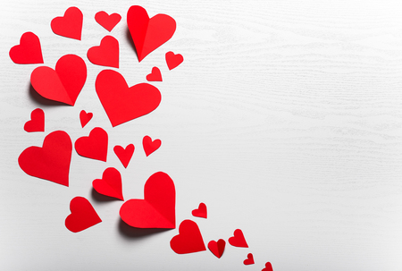 Wooden white background with red hearts. The concept of Valentine Day.の写真素材