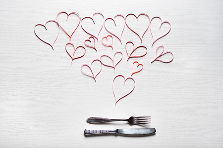 Wooden white background with red hearts. The concept of Valentine Day.の写真素材
