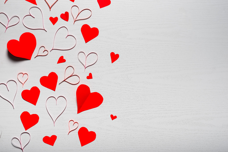 Wooden white background with red hearts. The concept of Valentine Day.の写真素材