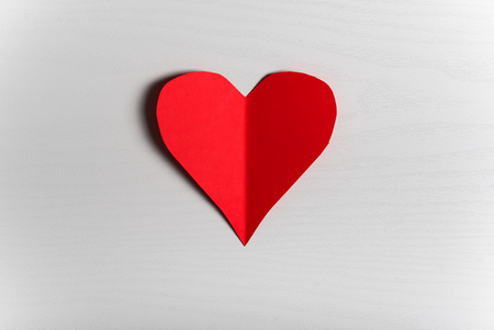 Wooden white background with red hearts. The concept of Valentine Day.の写真素材