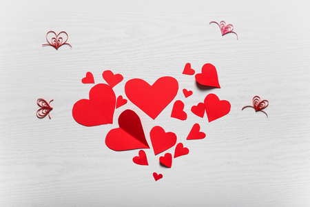 Wooden white background with red hearts. The concept of Valentine Day.の写真素材