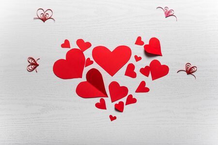 Wooden white background with red hearts. The concept of Valentine Day.の写真素材