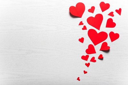 Wooden white background with red hearts. The concept of Valentine Day.の写真素材