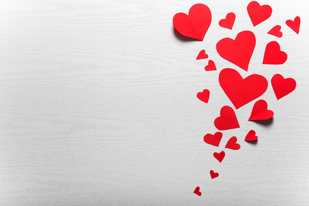 Wooden white background with red hearts. The concept of Valentine Day.の写真素材