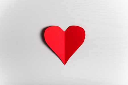 Wooden white background with red hearts. The concept of Valentine Day.の写真素材