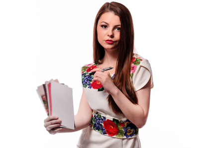 businesswoman holding a notebook isolated on a white backgroundの写真素材