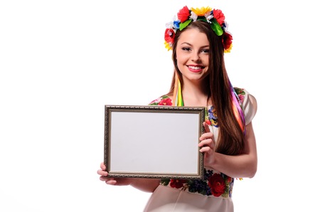 Smiling woman holding white sign board. Casual dressed girl with advertising banner.の写真素材