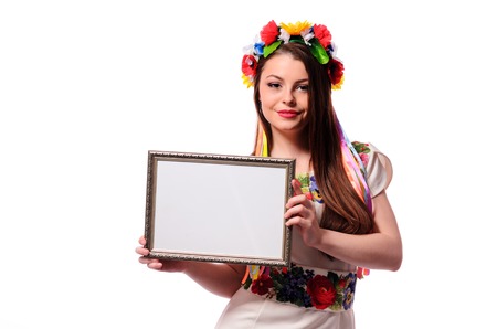 Smiling woman holding white sign board. Casual dressed girl with advertising banner.の写真素材