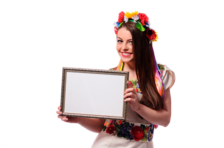 Smiling woman holding white sign board. Casual dressed girl with advertising banner.の写真素材