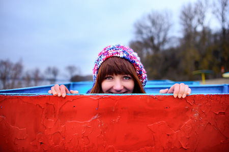 A young woman holding a yellow boardの写真素材