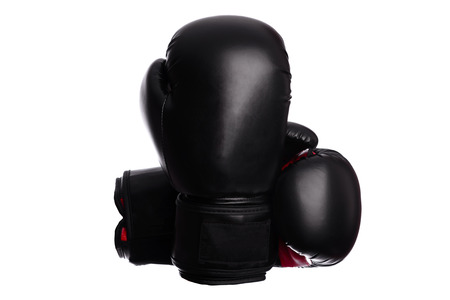 two crossed boxing mitts on a white backgroundの写真素材