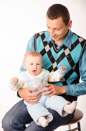 Father holds in his hands his little daughterの写真素材
