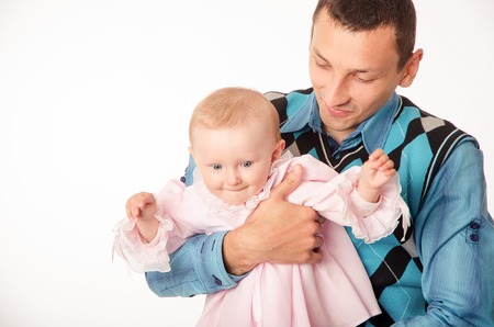 Parents with small daughter on a white backgroundの写真素材