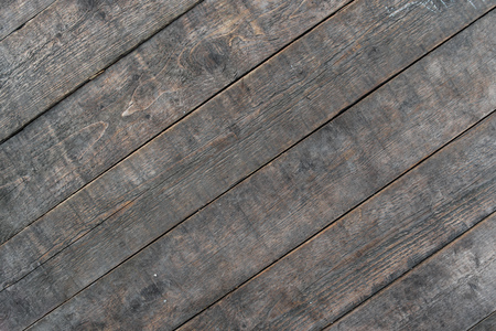 wood brown grain texture, dark wall background, top view of wooden tableの写真素材