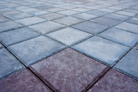 Concrete paving texture, top view of tiled gray square shaped slabsの写真素材