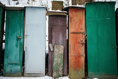 Winter landscape with fisherman boats lying on frozen lake shore. Winter lake landscapeの写真素材