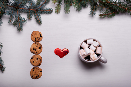 Ceramic cup of coffee, chocolate chip cookies, white boardの写真素材