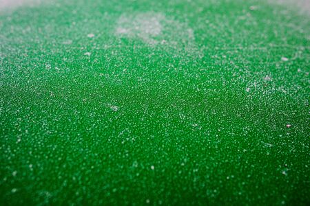 Green metal with frost on itの写真素材