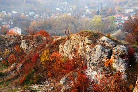 Rocky landscape during autumn. Beautiful landscape with stone, forest and fog. Sunset in czech national park. Misty evening autumn landscape. Landscape with rock hillsの写真素材