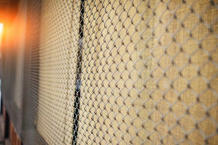 fence with metal grid in perspective, backgroundの写真素材
