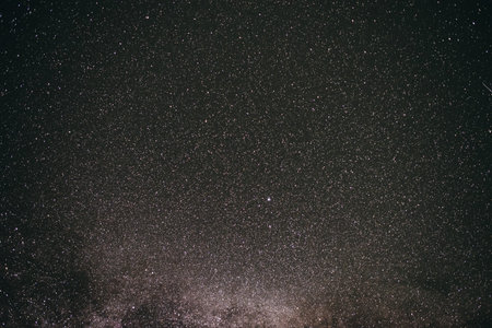 Background of gray starry night sky with the Milky Way.