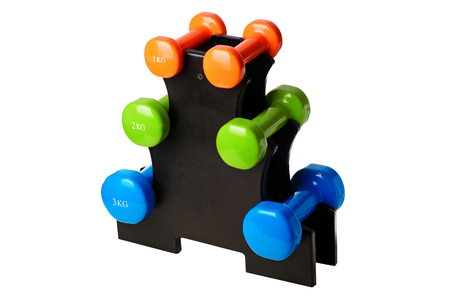 Set of colored isolated dumbbells for sport on a white background folded on a special black stand.の写真素材