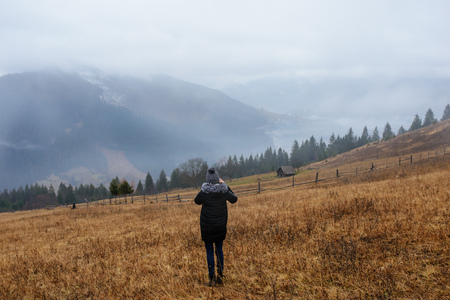 The girl picks up Carpathian mountains in winter.の写真素材