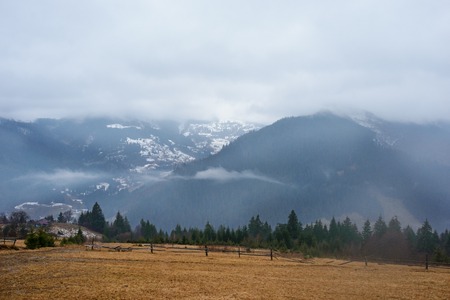 Beautiful view with morning fog in early spring, in Carpathian mountains,の写真素材