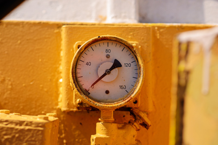 gauge pressure in the pipeline,a wall in the background.の写真素材