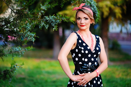 young beautiful caucasian woman posing in a dress .の写真素材