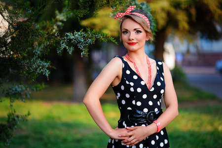 young beautiful caucasian woman posing in a dress .の写真素材