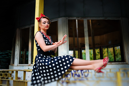 beautiful young woman posing in retro dress.の写真素材
