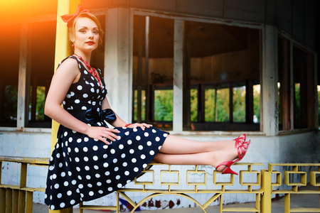 beautiful young woman posing in retro dress.の写真素材