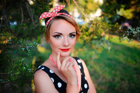 young beautiful caucasian woman posing in a dress .の写真素材