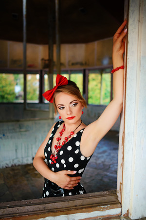 beautiful young woman posing in retro dress.の写真素材