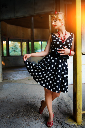 beautiful young woman posing in retro dress.の写真素材