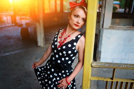 beautiful young woman posing in retro dress.の写真素材