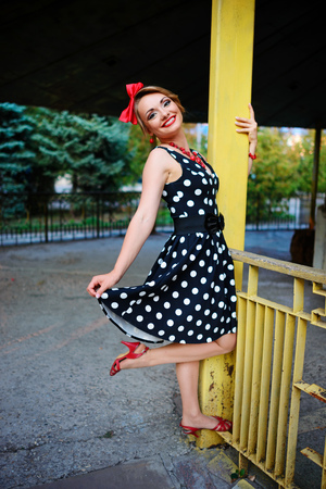 beautiful young woman posing in retro dress.の写真素材