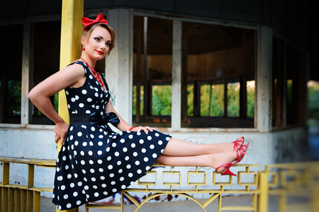 beautiful young woman posing in retro dress.の写真素材