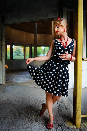 beautiful young woman posing in retro dress.の写真素材