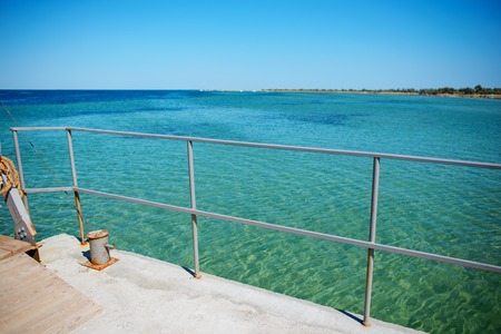 Swimming ladder from stainless steel for descent into sea water on pier. Silent bay ideal for children swim and play.の写真素材