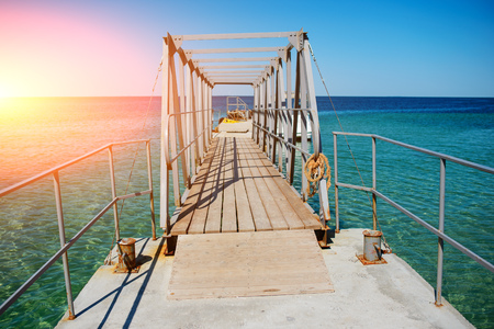Swimming ladder from stainless steel for descent into sea water on pier. Silent bay ideal for children swim and play.の写真素材