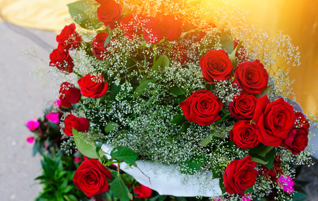 Bouquet of red roses on a black background. Top view.の写真素材