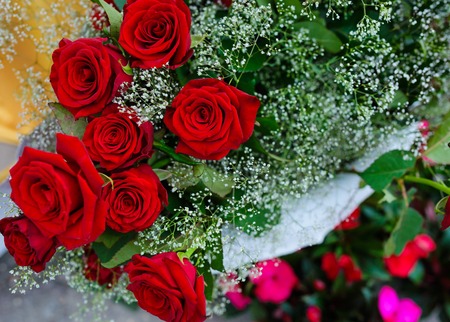 Bouquet of red roses on a black background. Top view.の写真素材