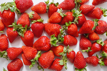 Fresh strawberry. Strawberries on white concrete background. Harvest of organic local strawberries.の写真素材