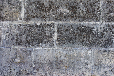 Stone wall of gray with old texture.の写真素材