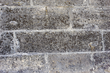 Stone wall of gray with old texture.の写真素材