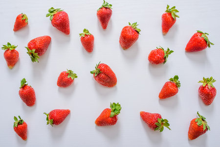 Fresh strawberry. Strawberries on white concrete background. Harvest of organic local strawberries.