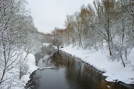 Winter landscape with the river in frosty day.の写真素材